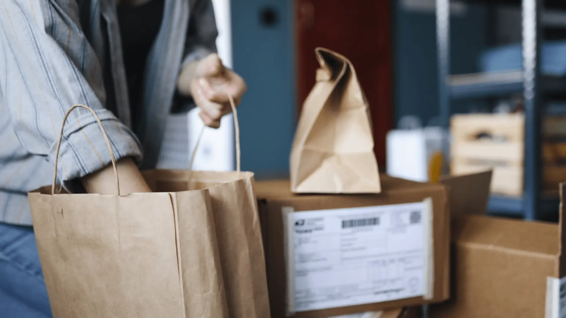 An online store owner sorts packages.