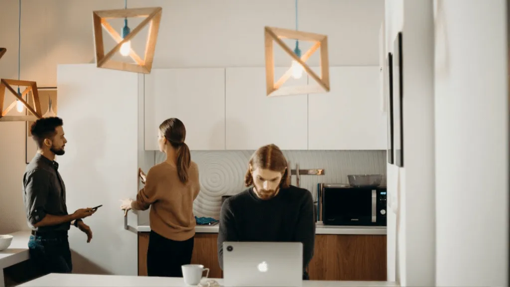 A man works on his laptop in a coworking space.