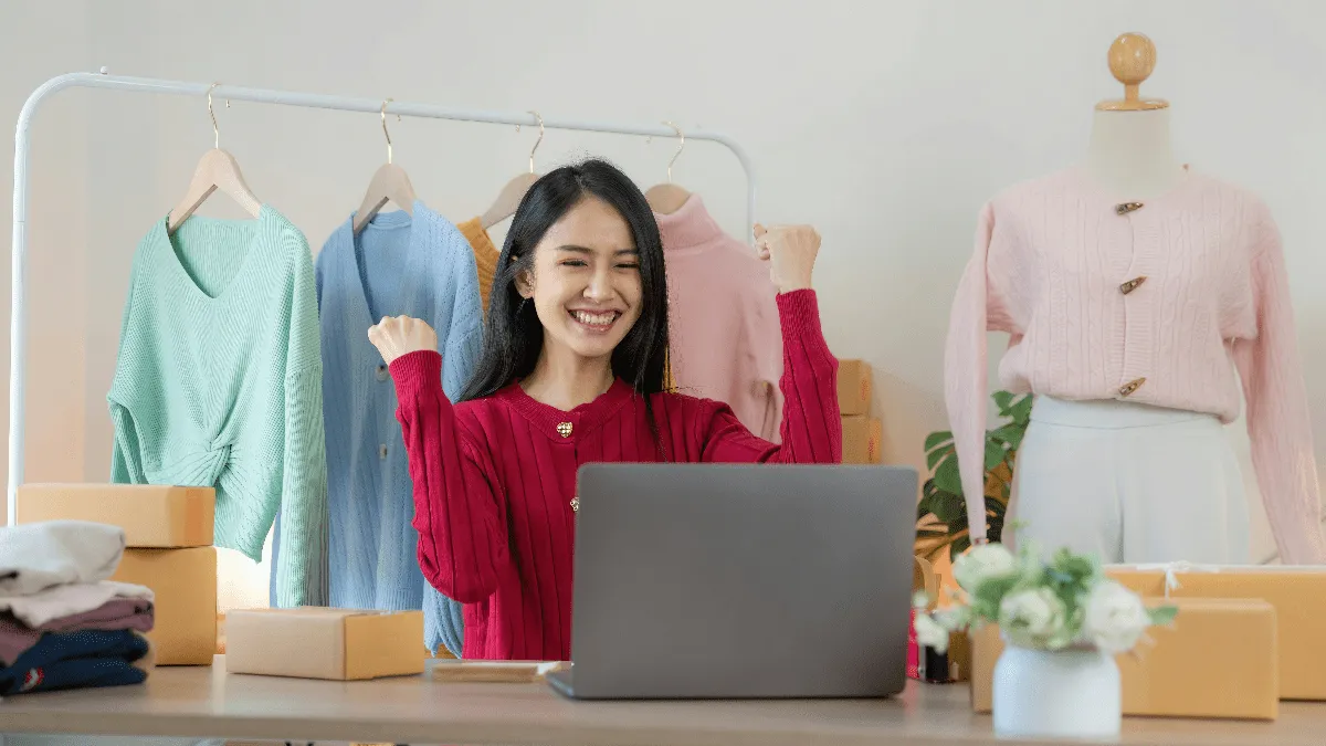 A women looking at a laptop.